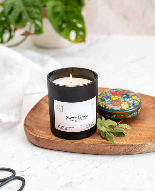 Sweet Grove Orchard scented candle styled in a bright home interior, handmade Dundee candle for spring and summer