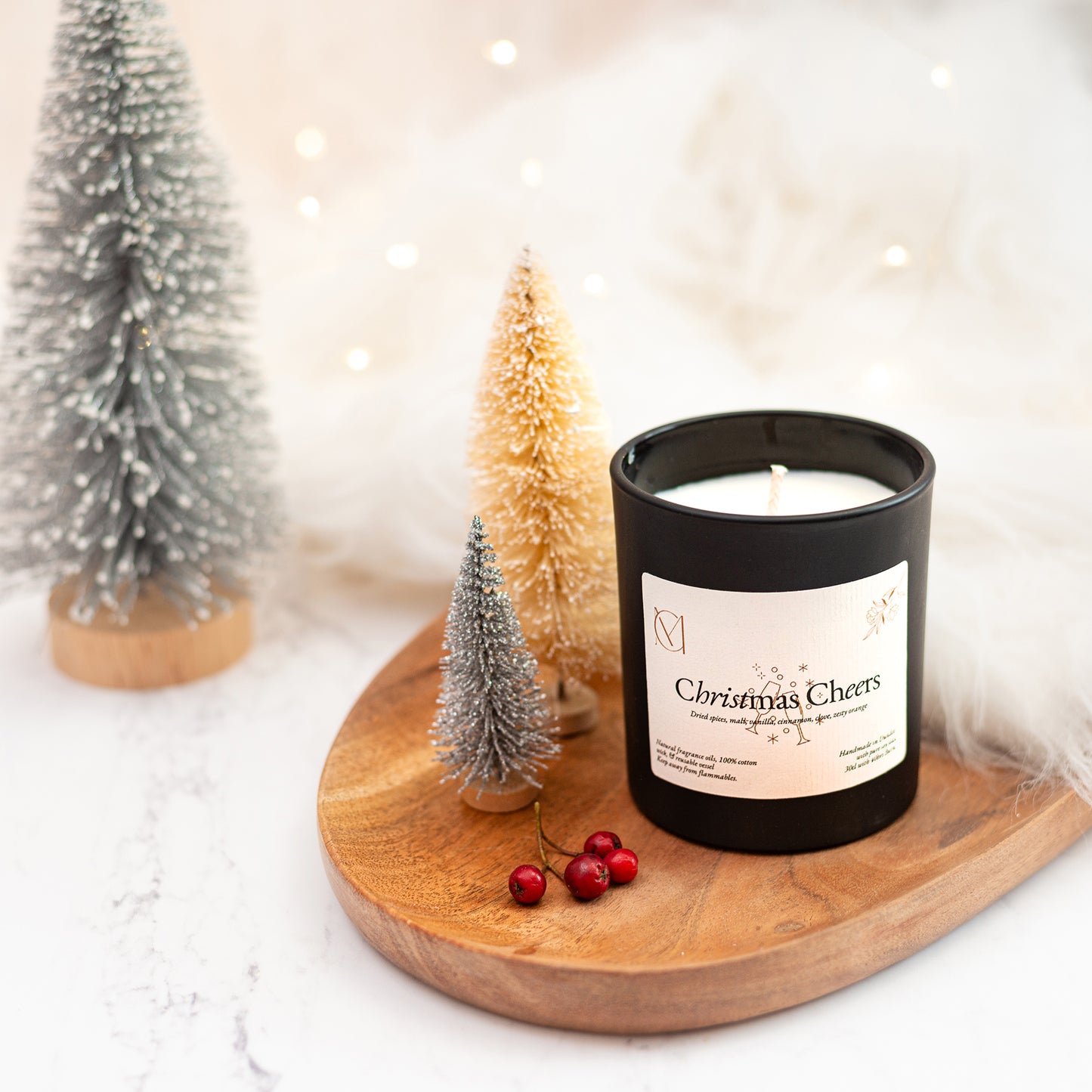 Handmade Christmas soy wax candle in Dundee Scotland with orange, vanilla and cinnamon fragrance in a black candle jar